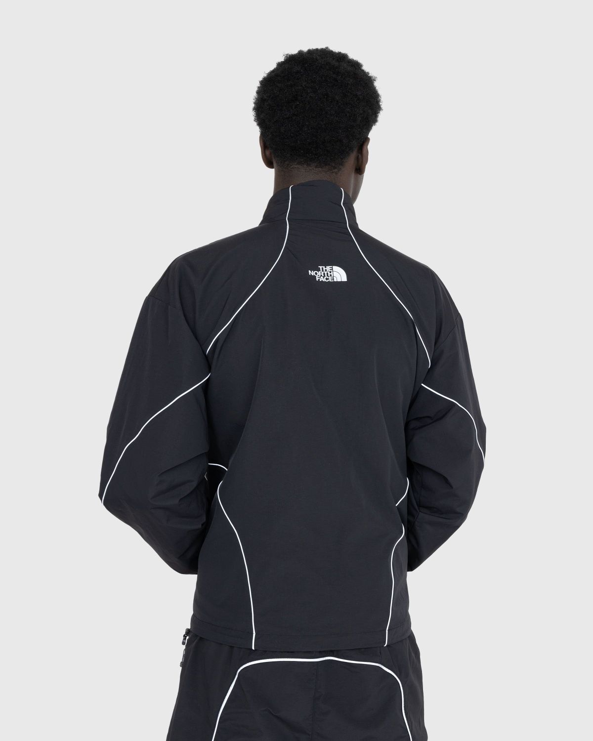 The North Face Tek Piping wind jacket in black